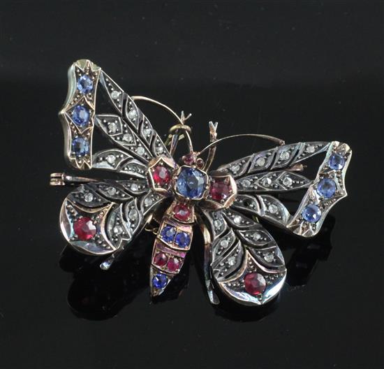 A Victorian gold and silver, sapphire, ruby and rose cut diamond set openwork butterfly brooch, 46mm.